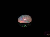an image of a white fire opal in the dark