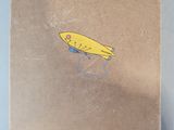 a brown book with a yellow bird on top of it