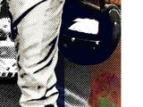 a black and white photo of a baseball player holding a bat