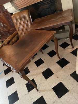 a chair and a table in a room with black and white checkered flooring