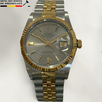 an image of a silver and gold rolex watch on a white background