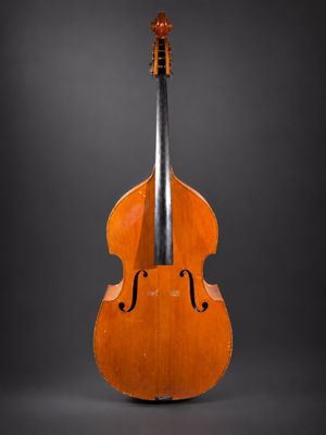 an old cello on a black background