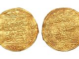 two gold coins with arabic writing on them