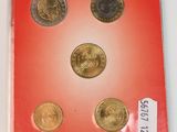 a red box with four different coins on it