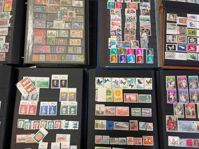 many different types of stamps on display on a table