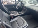 the interior of a car with a dashboard and a steering control