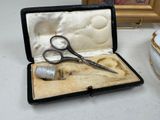 a pair of scissors in a case on a table