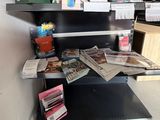 a shelf that has many books on it