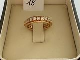 a ring in a box with a price tag on it