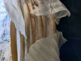 a man that is holding a bunch of clothes