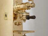 a gold clock that is sitting on a table