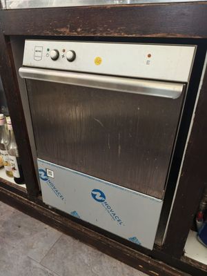 a silver dishwasher sitting inside of a kitchen