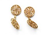 a pair of gold earrings on a white background