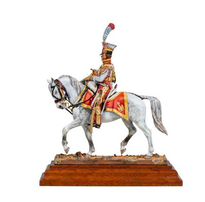 figurine of a soldier on a horse on a wooden base
