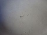 a close up of a white plate with a number on it