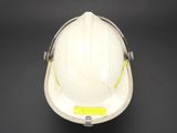a close up of a hard hat on a black background