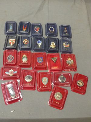 a table with a lot of badges and medals on it