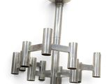 a close up of a chandelier made out of metal tubes