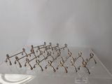a glass display case with a bunch of hooks on it