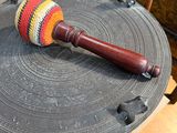 a wooden stick that is on top of a drum