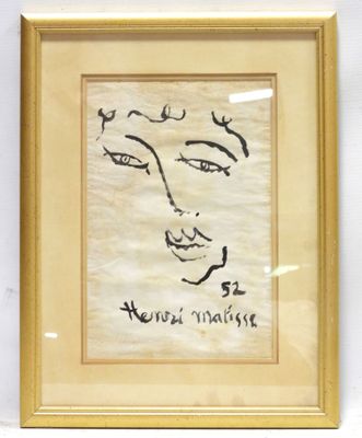 painting of a woman ' s face in a gold frame on a white wall