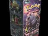 a box of pokemon trading cards on a black background