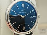 a close up of a wrist watch with a blue dial