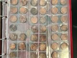 a lot of coins that are in a binder