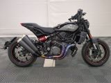 a picture of a motorcycle parked in a garage