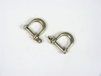 a pair of metal shacks on a white surface