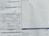 a picture of a car ' s driver ' s license and a receipt