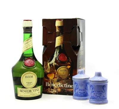 a bottle of alcohol next to a canister and a box