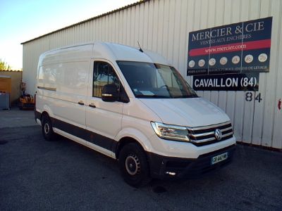 the white van is parked in front of a building