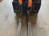 a forklift that is parked in a garage