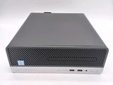 a close up of a desktop computer on a white surface