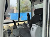 a view of the inside of a truck with a seat and steering wheel