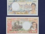 deux billets sur lesquels figurent les portraits d'un homme et d'une femme