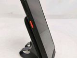 a cell phone that is sitting on a stand