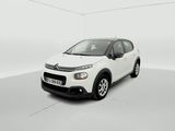 a white citrole is parked in a white room