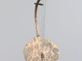 an image of a musical instrument hanging from a string