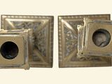 pair of antique brass door knobs with a picture of a man in the center