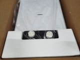 a box that has a pair of white buttons in it