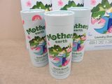 three bottles of mother earth baby lotion sitting next to a box of mother earth baby lotion