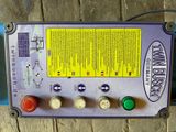 an image of a control panel on a wooden floor