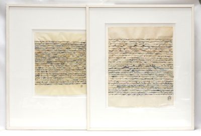 two framed pieces of paper with writing on them on a shelf