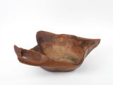 a wooden bowl that is shaped like a bird