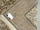 an image of a rug with a tag on it sitting on a floor