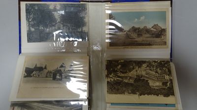 several old postcards are sitting in a case on a table