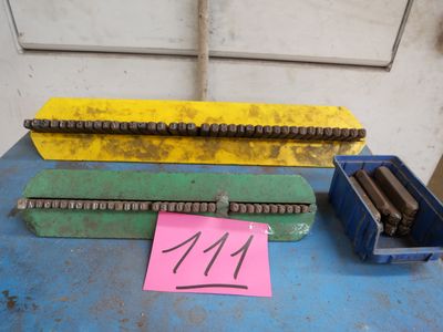 a table topped with assorted metal items on top of a blue table