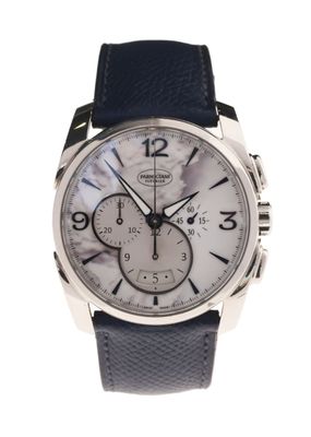 a close up of a watch on a white background with a blue strap